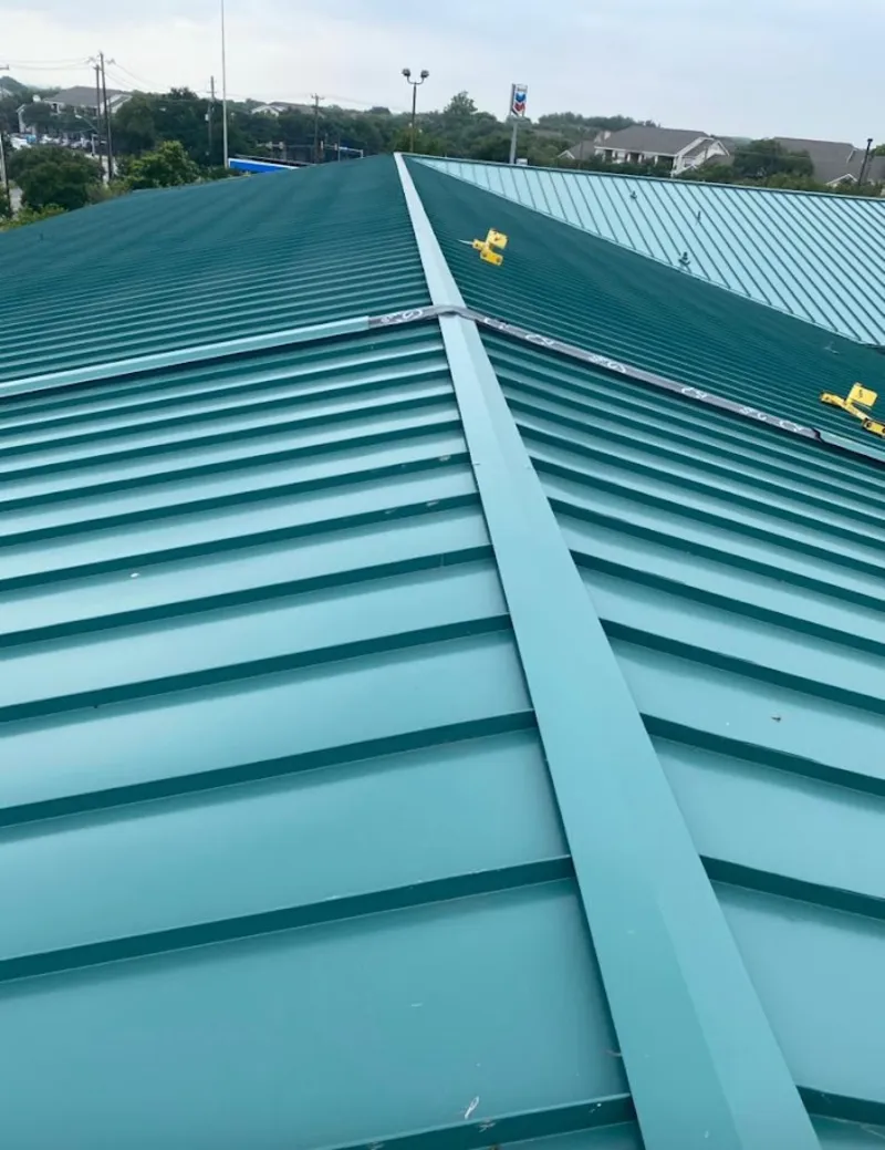 Green commercial metal roof ridge and valley for Metal Roof Repair in Denham Springs